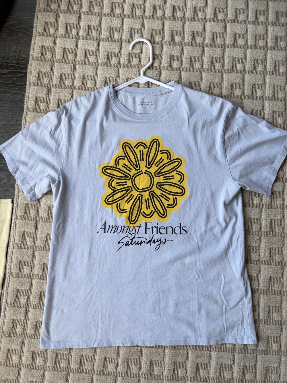 Saturdays New York City White Tee with Yellow Daisy Graphic